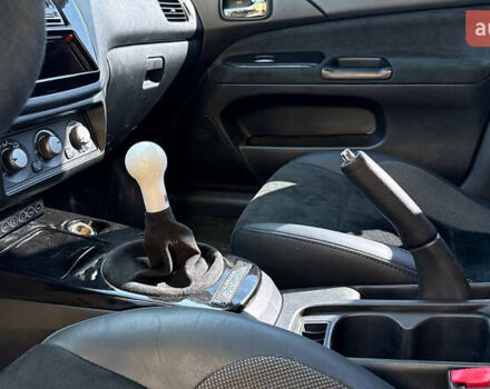 Жовтий Міцубісі Лансер Еволюшн, об'ємом двигуна 2 л та пробігом 124 тис. км за 32000 $, фото 3 на Automoto.ua