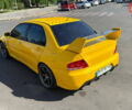 Жовтий Міцубісі Лансер Еволюшн, об'ємом двигуна 2 л та пробігом 124 тис. км за 32000 $, фото 26 на Automoto.ua