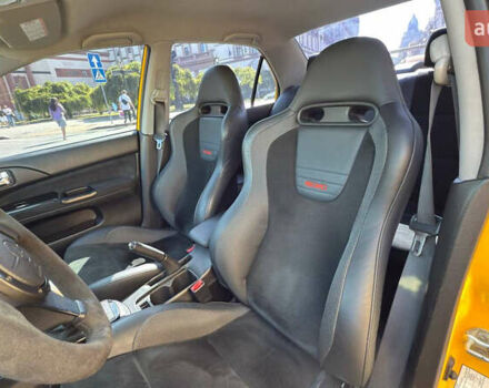 Жовтий Міцубісі Лансер Еволюшн, об'ємом двигуна 2 л та пробігом 124 тис. км за 32000 $, фото 22 на Automoto.ua