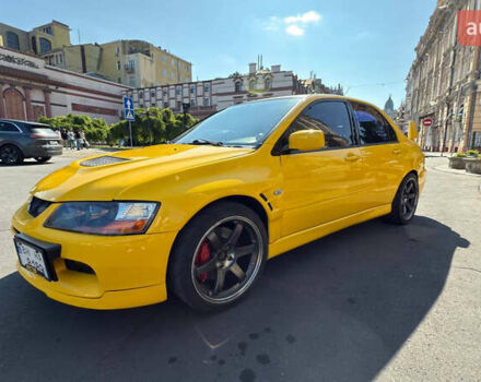 Жовтий Міцубісі Лансер Еволюшн, об'ємом двигуна 2 л та пробігом 124 тис. км за 32000 $, фото 1 на Automoto.ua