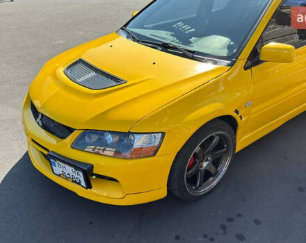 Жовтий Міцубісі Лансер Еволюшн, об'ємом двигуна 2 л та пробігом 124 тис. км за 32000 $, фото 2 на Automoto.ua