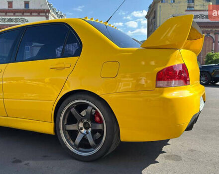 Жовтий Міцубісі Лансер Еволюшн, об'ємом двигуна 2 л та пробігом 124 тис. км за 32000 $, фото 24 на Automoto.ua