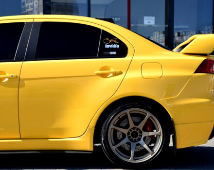 Желтый Мицубиси Лансер Эволюшн, объемом двигателя 2 л и пробегом 180 тыс. км за 24999 $, фото 40 на Automoto.ua