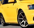 Желтый Мицубиси Лансер Эволюшн, объемом двигателя 2 л и пробегом 180 тыс. км за 24999 $, фото 6 на Automoto.ua