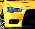 Жовтий Міцубісі Лансер Еволюшн, об'ємом двигуна 2 л та пробігом 180 тис. км за 24999 $, фото 8 на Automoto.ua