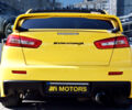 Желтый Мицубиси Лансер Эволюшн, объемом двигателя 2 л и пробегом 180 тыс. км за 24999 $, фото 5 на Automoto.ua