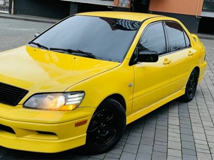 Жовтий Міцубісі Лансер Еволюшн, об'ємом двигуна 2 л та пробігом 160 тис. км за 3999 $, фото 1 на Automoto.ua