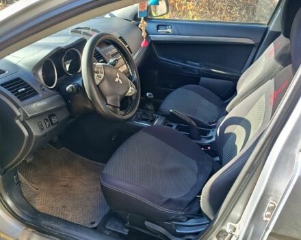 Серый Мицубиси Лансер Эволюшн, объемом двигателя 2 л и пробегом 230 тыс. км за 6600 $, фото 6 на Automoto.ua