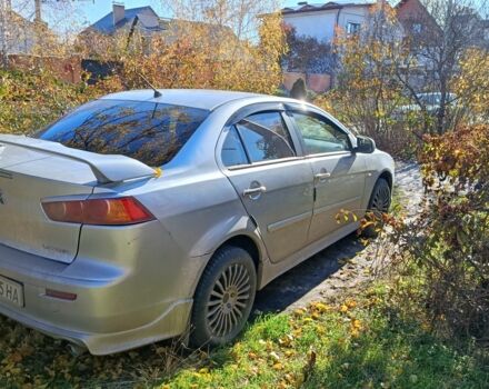 Серый Мицубиси Лансер Эволюшн, объемом двигателя 2 л и пробегом 230 тыс. км за 6600 $, фото 3 на Automoto.ua