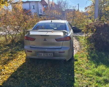 Серый Мицубиси Лансер Эволюшн, объемом двигателя 2 л и пробегом 230 тыс. км за 6600 $, фото 4 на Automoto.ua