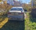 Серый Мицубиси Лансер Эволюшн, объемом двигателя 2 л и пробегом 230 тыс. км за 6600 $, фото 4 на Automoto.ua