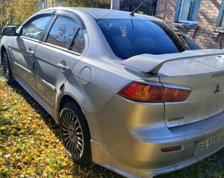 Серый Мицубиси Лансер Эволюшн, объемом двигателя 2 л и пробегом 230 тыс. км за 6600 $, фото 5 на Automoto.ua