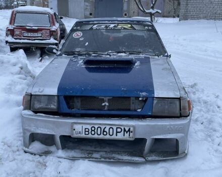 Серый Мицубиси Лансер Эволюшн, объемом двигателя 1.6 л и пробегом 258 тыс. км за 400 $, фото 1 на Automoto.ua