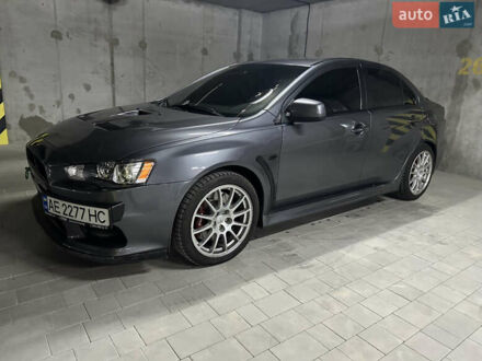 Серый Мицубиси Лансер Эволюшн, объемом двигателя 2 л и пробегом 150 тыс. км за 18500 $, фото 1 на Automoto.ua