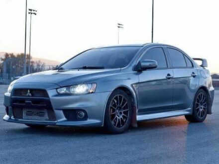 Сірий Міцубісі Лансер Еволюшн, об'ємом двигуна 2 л та пробігом 99 тис. км за 9100 $, фото 1 на Automoto.ua