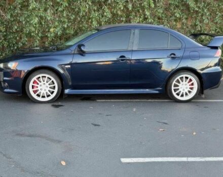 Синий Мицубиси Лансер Эволюшн, объемом двигателя 2 л и пробегом 144 тыс. км за 11000 $, фото 4 на Automoto.ua