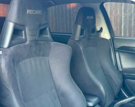 Синий Мицубиси Лансер Эволюшн, объемом двигателя 2 л и пробегом 144 тыс. км за 11000 $, фото 10 на Automoto.ua