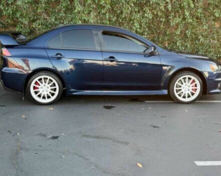 Синий Мицубиси Лансер Эволюшн, объемом двигателя 2 л и пробегом 144 тыс. км за 11000 $, фото 5 на Automoto.ua