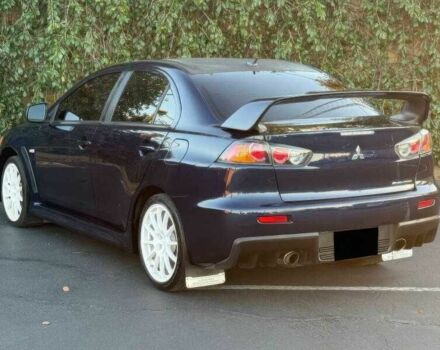 Синий Мицубиси Лансер Эволюшн, объемом двигателя 2 л и пробегом 144 тыс. км за 11000 $, фото 3 на Automoto.ua