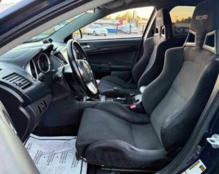 Синий Мицубиси Лансер Эволюшн, объемом двигателя 2 л и пробегом 144 тыс. км за 11000 $, фото 7 на Automoto.ua