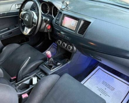 Синий Мицубиси Лансер Эволюшн, объемом двигателя 2 л и пробегом 144 тыс. км за 11000 $, фото 11 на Automoto.ua