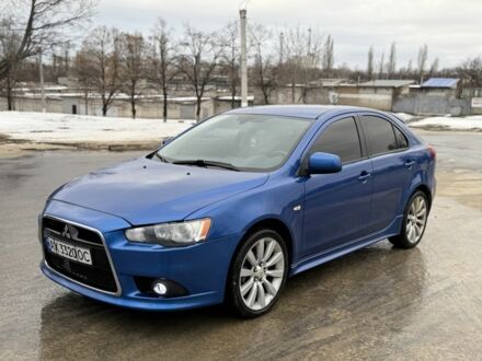 Синій Міцубісі Лансер Еволюшн, об'ємом двигуна 2 л та пробігом 212 тис. км за 8999 $, фото 1 на Automoto.ua