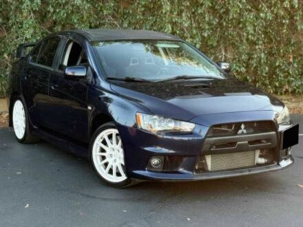 Синий Мицубиси Лансер Эволюшн, объемом двигателя 2 л и пробегом 144 тыс. км за 11000 $, фото 1 на Automoto.ua