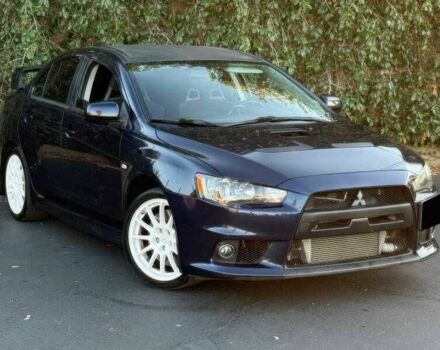 Синий Мицубиси Лансер Эволюшн, объемом двигателя 2 л и пробегом 144 тыс. км за 11000 $, фото 1 на Automoto.ua