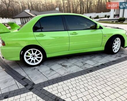 Зеленый Мицубиси Лансер Эволюшн, объемом двигателя 2 л и пробегом 135 тыс. км за 38500 $, фото 13 на Automoto.ua