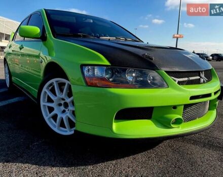 Зеленый Мицубиси Лансер Эволюшн, объемом двигателя 2 л и пробегом 135 тыс. км за 38500 $, фото 1 на Automoto.ua