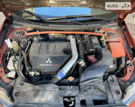 Оранжевый Мицубиси Лансер Эволюшн, объемом двигателя 2 л и пробегом 140 тыс. км за 10850 $, фото 10 на Automoto.ua