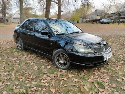 Черный Мицубиси Лансер Спортбэк, объемом двигателя 2 л и пробегом 219 тыс. км за 3999 $, фото 1 на Automoto.ua