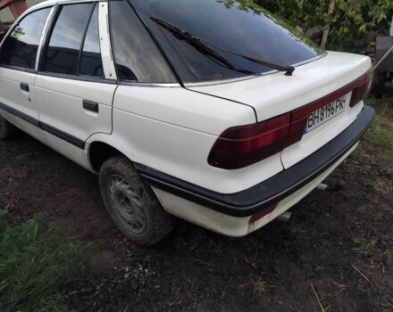 Белый Мицубиси Лансер, объемом двигателя 1.8 л и пробегом 86 тыс. км за 700 $, фото 2 на Automoto.ua