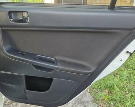 Білий Міцубісі Lancer, об'ємом двигуна 1.5 л та пробігом 154 тис. км за 8700 $, фото 29 на Automoto.ua