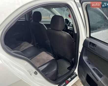 Белый Мицубиси Лансер, объемом двигателя 1.8 л и пробегом 258 тыс. км за 6500 $, фото 1 на Automoto.ua