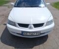 Белый Мицубиси Лансер, объемом двигателя 1.6 л и пробегом 230 тыс. км за 4000 $, фото 1 на Automoto.ua
