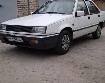 Белый Мицубиси Лансер, объемом двигателя 1.46 л и пробегом 250 тыс. км за 1300 $, фото 4 на Automoto.ua