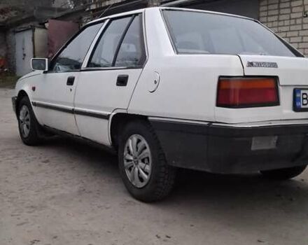 Белый Мицубиси Лансер, объемом двигателя 1.46 л и пробегом 250 тыс. км за 1300 $, фото 2 на Automoto.ua