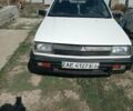 Білий Міцубісі Lancer, об'ємом двигуна 1.2 л та пробігом 237 тис. км за 1143 $, фото 1 на Automoto.ua