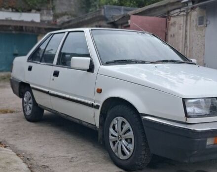 Белый Мицубиси Лансер, объемом двигателя 1.5 л и пробегом 250 тыс. км за 1300 $, фото 1 на Automoto.ua