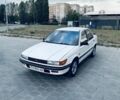 Белый Мицубиси Лансер, объемом двигателя 1.5 л и пробегом 545 тыс. км за 673 $, фото 1 на Automoto.ua