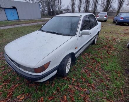 Белый Мицубиси Лансер, объемом двигателя 1.5 л и пробегом 400 тыс. км за 1300 $, фото 1 на Automoto.ua