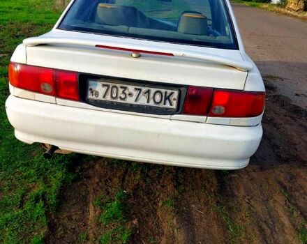 Белый Мицубиси Лансер, объемом двигателя 1.3 л и пробегом 268 тыс. км за 800 $, фото 1 на Automoto.ua