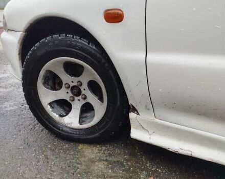 Білий Міцубісі Lancer, об'ємом двигуна 1.3 л та пробігом 300 тис. км за 1700 $, фото 12 на Automoto.ua