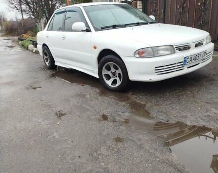 Білий Міцубісі Lancer, об'ємом двигуна 1.3 л та пробігом 300 тис. км за 1700 $, фото 7 на Automoto.ua