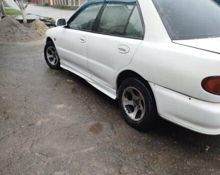 Білий Міцубісі Lancer, об'ємом двигуна 1.3 л та пробігом 300 тис. км за 1700 $, фото 13 на Automoto.ua