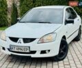 Білий Міцубісі Lancer, об'ємом двигуна 1.58 л та пробігом 330 тис. км за 2850 $, фото 1 на Automoto.ua