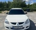 Белый Мицубиси Лансер, объемом двигателя 1.6 л и пробегом 250 тыс. км за 3500 $, фото 1 на Automoto.ua