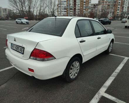 Белый Мицубиси Лансер, объемом двигателя 1.6 л и пробегом 306 тыс. км за 3000 $, фото 2 на Automoto.ua