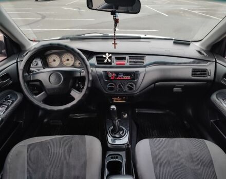 Белый Мицубиси Лансер, объемом двигателя 1.6 л и пробегом 306 тыс. км за 3000 $, фото 12 на Automoto.ua